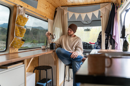 Man Making Coffee in Van