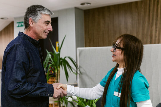 Dentist Greeting Patient