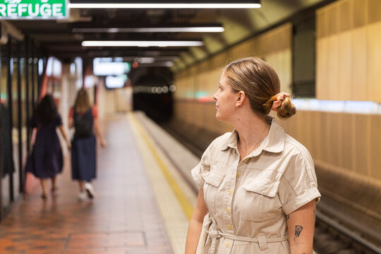 Woman Waiting at a Subway Station in Melbourne Australia