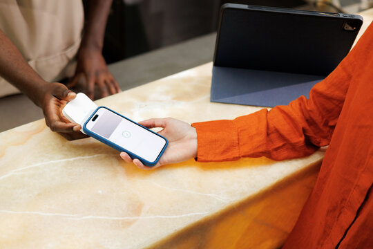 Close-Up of Mobile Phone Tap Payment in Caf&eacute;