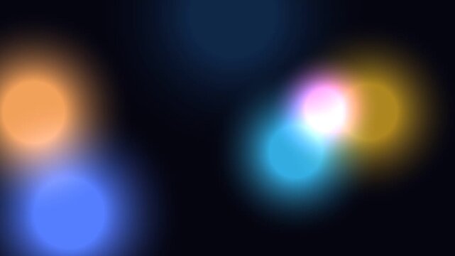 Colorful Blurred Lights Against Dark Background.