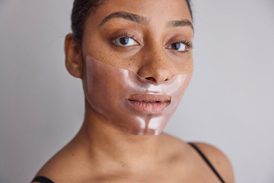 Woman wearing a cosmetic face mask 