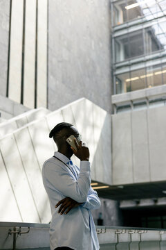 Professional Man Using Devices in Modern Office