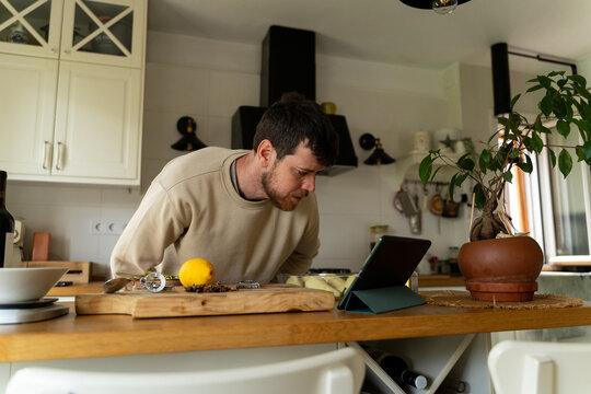 Man reading recipe tablet
