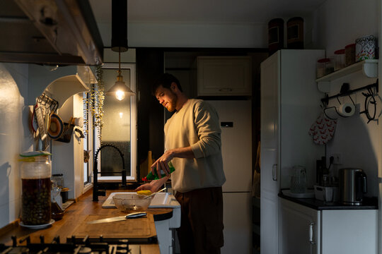 Man cooking in kitchen

