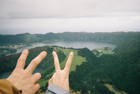 Hands framing scenic lake