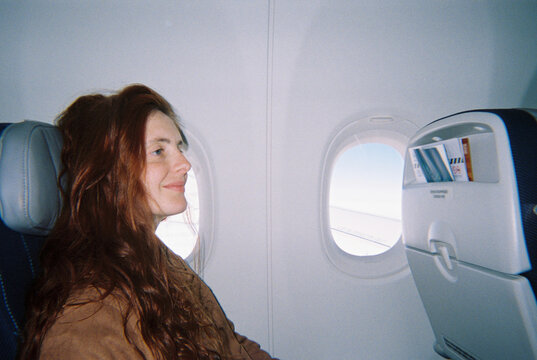 Smiling woman airplane