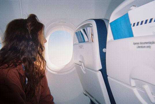 Woman plane window