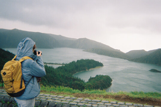 Woman Photographing Lake
