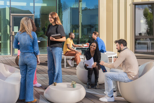 Coworkers Socializing In Outdoor Workspace