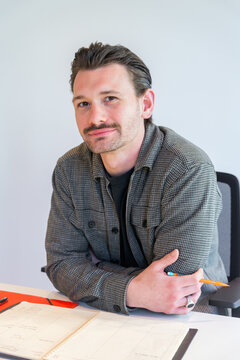Confident Professional At Work Desk