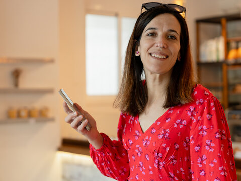 woman using smartphone in a store