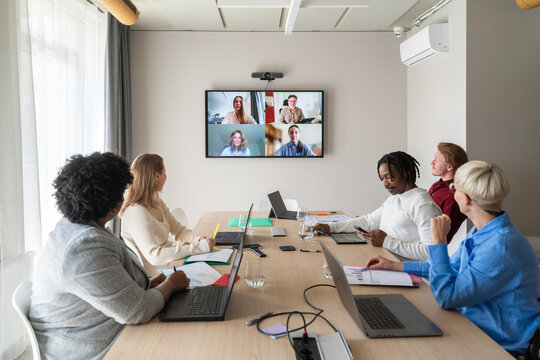 Brainstorming At Hybrid Meeting with Team and Virtual Coworkers
