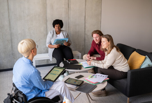 Diverse Team in Informal Office Meeting