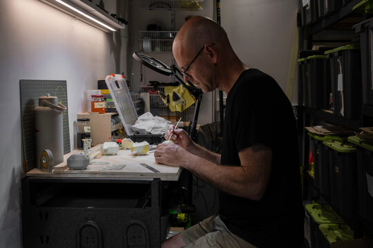 Man working on his craft project at a work bench