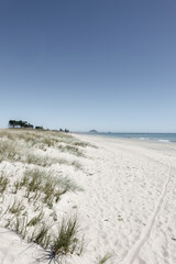  Papamoa Long Beach View sand, sky  and sea to distant horizon and landmark Mount Maunganui.