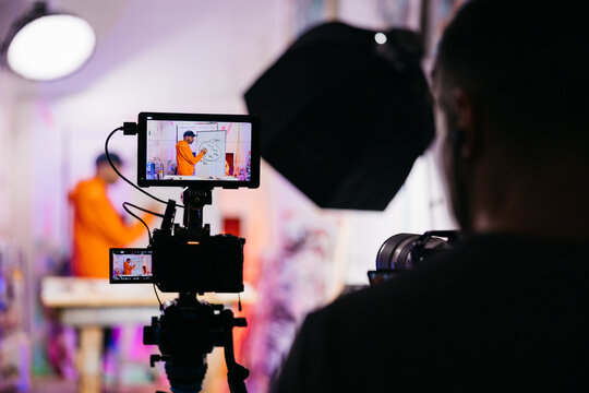 Close-up of artist drawing diagram on camera

