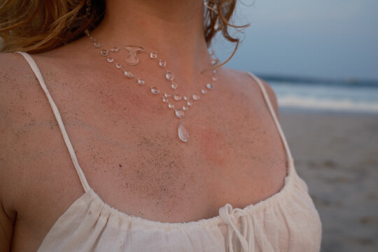 Detail Girl at Beach with Water Droplet Necklace