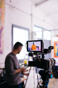 Camera screen showing artist in livestream 

