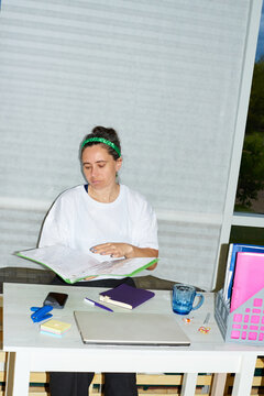 An employee works with a folder in the office.