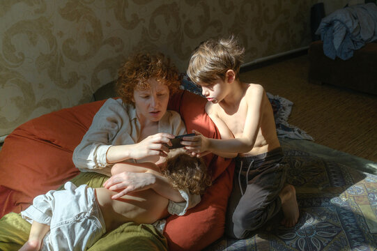 mother and son looking at phone