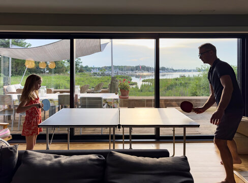 Father Daughter together family play ping Pong 