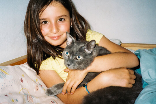 Girl Hugging Cat. Film portrait