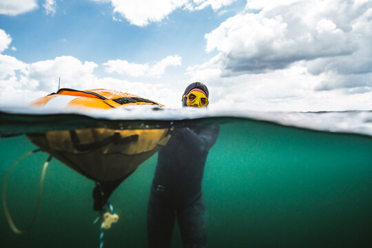 Freediving Instructor at Surface Holding Buoy &acirc; Split View
