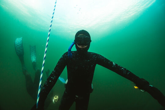 Freediving Student Underwater Near Descent Line