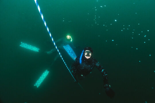 Freediver Training at Buoy Line in Deep Water