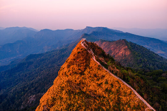 Breathtaking Sunrise Over Phu Chi Dao Mountain Chiang Rai Thailand Captivating Aerial Landscape Photography in a Serene Natural Environment