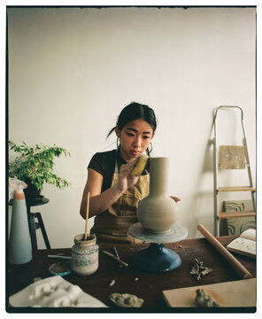 Young Artist Crafting Ceramic Pottery 