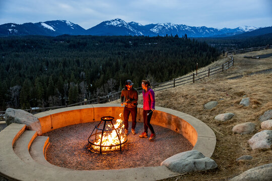 A couple roasting marshmallows
