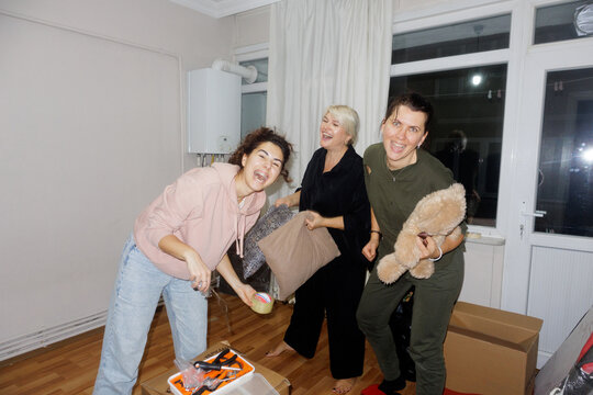 Portrait of three young women during a move