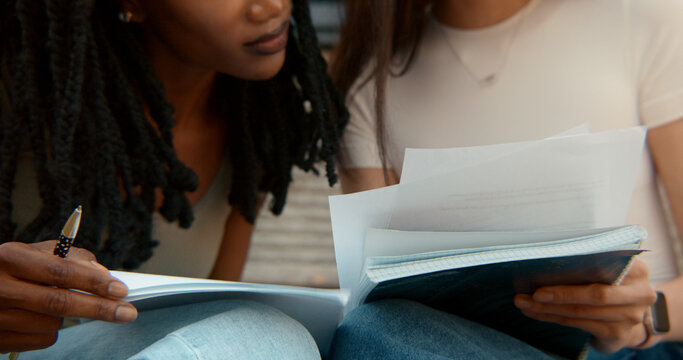 Students studying and learning together outdoors