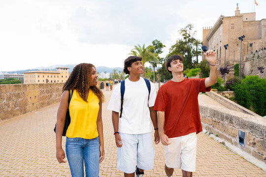 Students walking and taking pictures in palma de mallorca city center