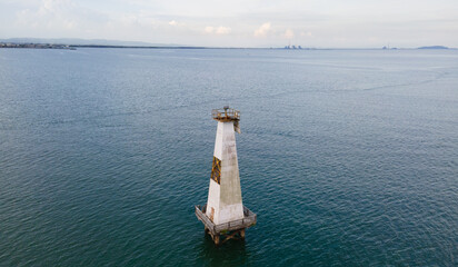 Offshore Lighthouse at Sea from Above. Elevated Aerial View of Coastal Navigation Beacon