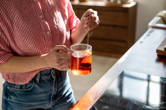 Anonymous young girl holding a cup of Rooibos tea