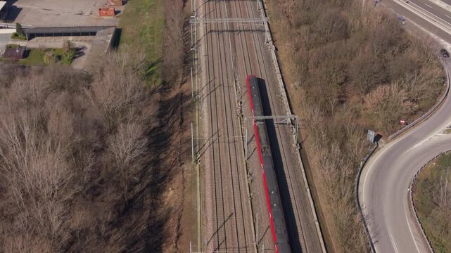 Railway Tracks and Commuting Train: An aerial perspective captures the essence of modern transportation, with parallel railway tracks converging in the distance.