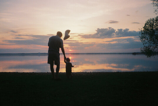 Father and Toddler by the Lake at Sunset  - film analog