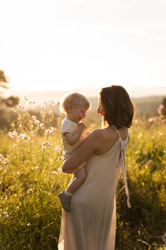 Mother holding smiling baby