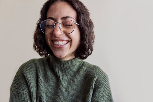 Young woman wearing eyeglasses in natural light