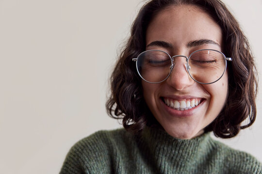 Young woman wearing eyeglasses in natural light