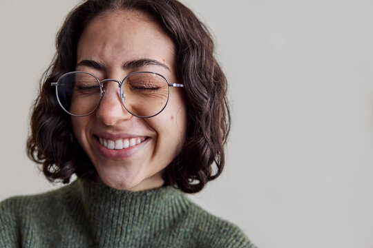 Young woman wearing eyeglasses in natural light
