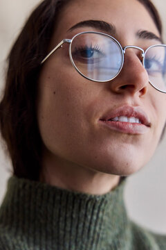 Young woman wearing eyeglasses in natural light