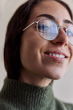 Young woman wearing eyeglasses in natural light
