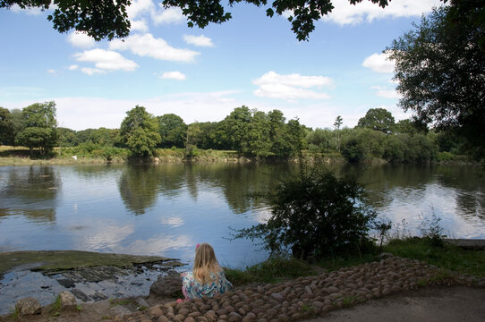 Girl on the border of a river