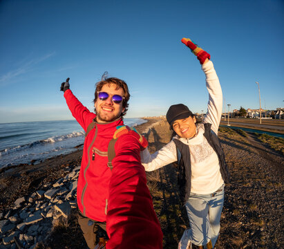 UGC Couples Enjoy a Beach Walk During Golden Hour by the Ocean 