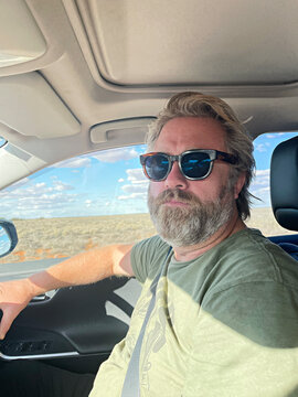 Man on vacation driving in outback Australia