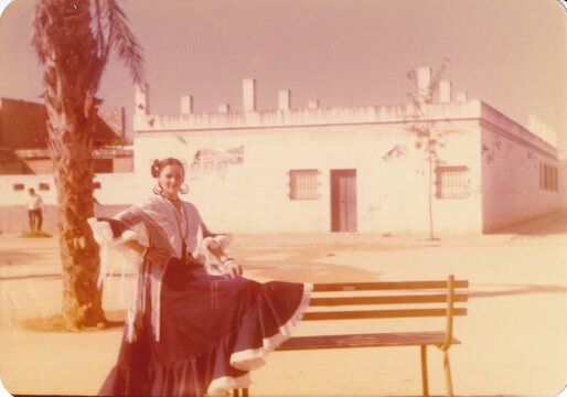 Woman in Flamenco Dress posing in a sunny day